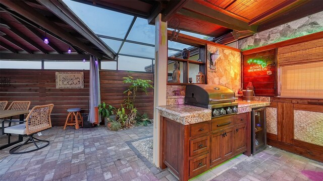 5500 Merrimac Dr, Sarasota, FL 34231 - view of patio / terrace with grilling area, an outdoor kitchen, beverage cooler, and fence
