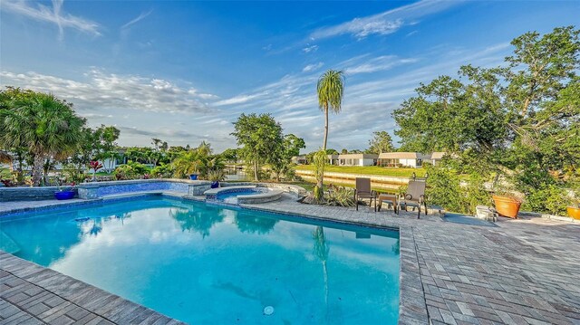 5500 Merrimac Dr, Sarasota, FL 34231 - view of pool with a pool with connected hot tub and a patio area