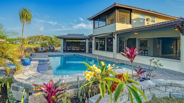 5500 Merrimac Dr, Sarasota, FL 34231 - view of pool featuring a sunroom, a patio area, a gazebo, and a pool with connected hot tub