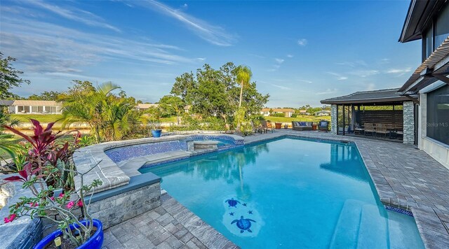 5500 Merrimac Dr, Sarasota, FL 34231 - view of swimming pool with a patio area and a pool with connected hot tub