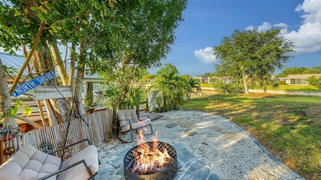 5500 Merrimac Dr, Sarasota, FL 34231 - view of patio / terrace with an outdoor fire pit
