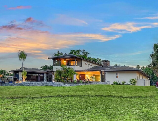 5500 Merrimac Dr, Sarasota, FL 34231 - view of front facade with a gazebo, stucco siding, and a chimney