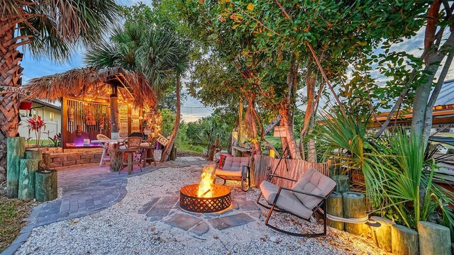 5500 Merrimac Dr, Sarasota, FL 34231 - view of patio / terrace featuring a fire pit and fence