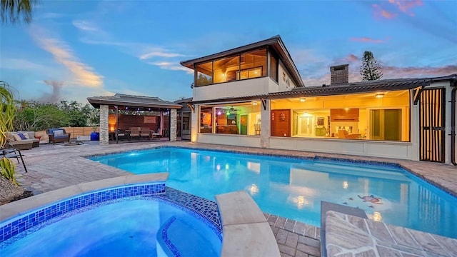 5500 Merrimac Dr, Sarasota, FL 34231 - view of pool featuring an outdoor living space, a patio, a pool with connected hot tub, and a gazebo