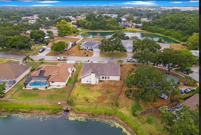view of property location featuring a large body of water, nearby suburban area, and a pool area