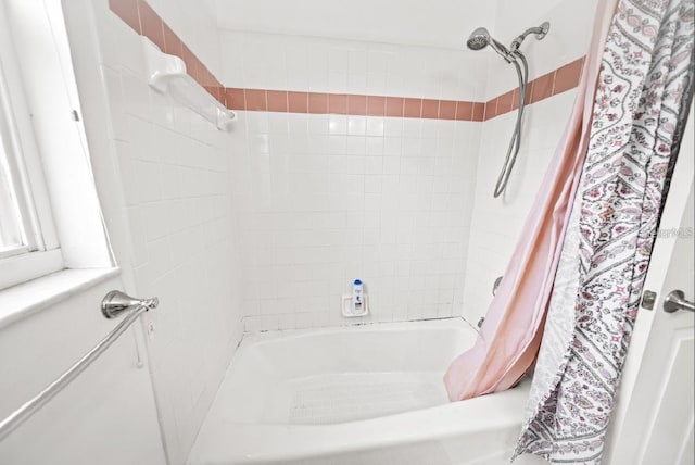full bathroom featuring shower / bath combo with shower curtain