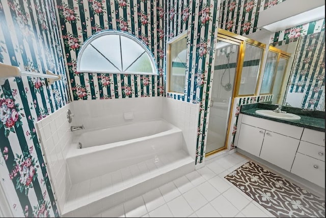 full bathroom with wallpapered walls, a shower stall, vanity, a bath, and tile patterned floors