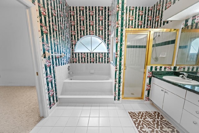bathroom featuring wallpapered walls, a stall shower, vanity, a bath, and tile patterned floors