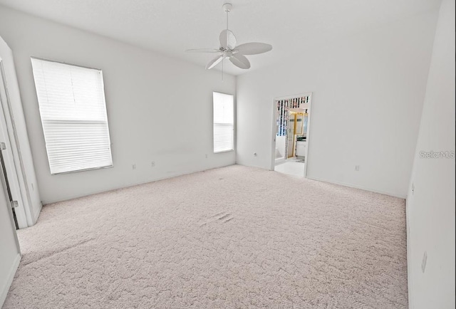 unfurnished room featuring carpet floors and a ceiling fan