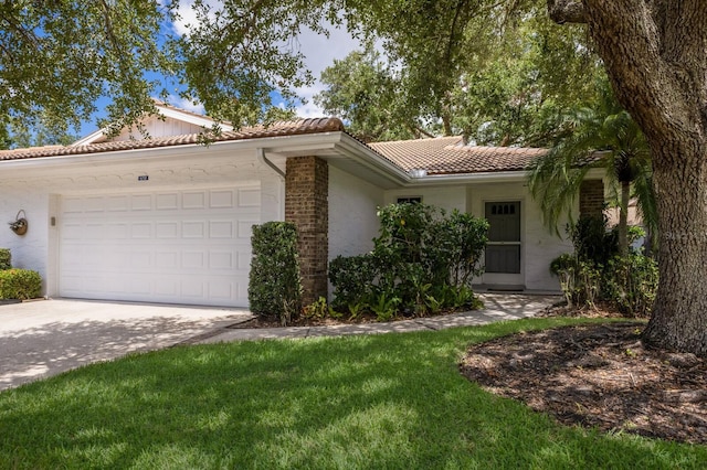 5712 Garden Lakes Dr, Bradenton, FL 34203 - single story home featuring a tiled roof, a garage, concrete driveway, and stucco siding