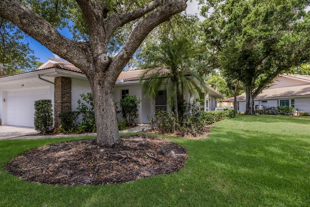 5712 Garden Lakes Dr, Bradenton, FL 34203 - ranch-style house with a garage, a front lawn, and a tile roof