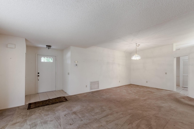 5712 Garden Lakes Dr, Bradenton, FL 34203 - carpeted foyer entrance with a textured ceiling