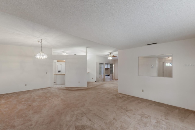 5712 Garden Lakes Dr, Bradenton, FL 34203 - unfurnished living room featuring light colored carpet, a textured ceiling, and ceiling fan