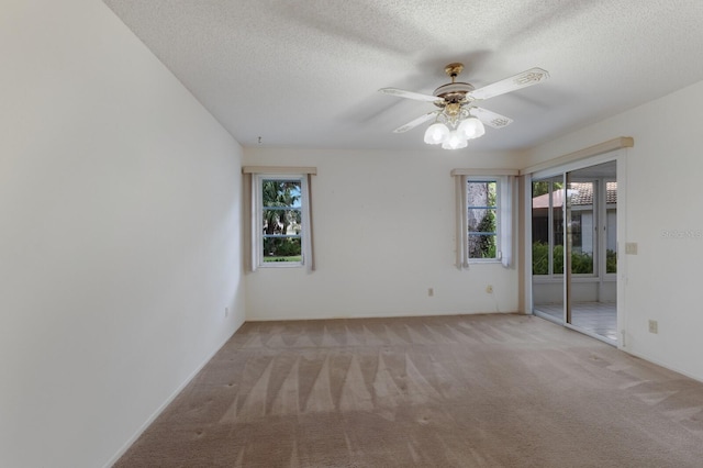 5712 Garden Lakes Dr, Bradenton, FL 34203 - carpeted empty room with plenty of natural light, ceiling fan, and a textured ceiling