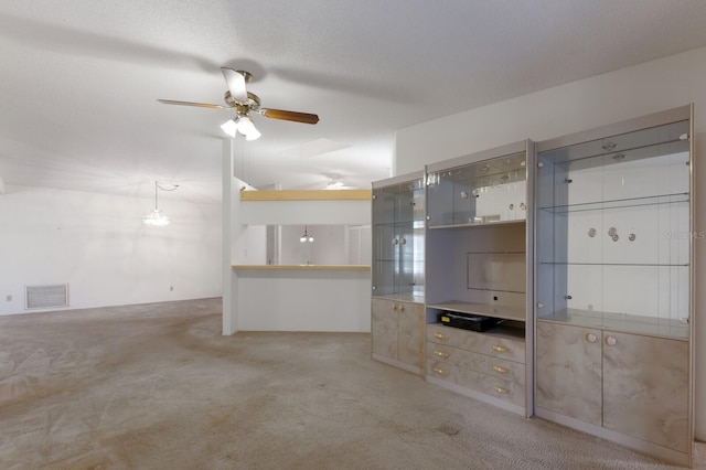 5712 Garden Lakes Dr, Bradenton, FL 34203 - unfurnished living room with carpet flooring and a ceiling fan