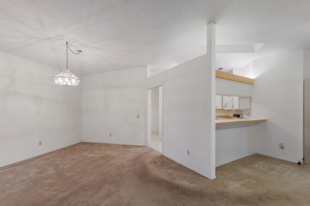 5712 Garden Lakes Dr, Bradenton, FL 34203 - unfurnished dining area featuring light colored carpet, a chandelier, and lofted ceiling