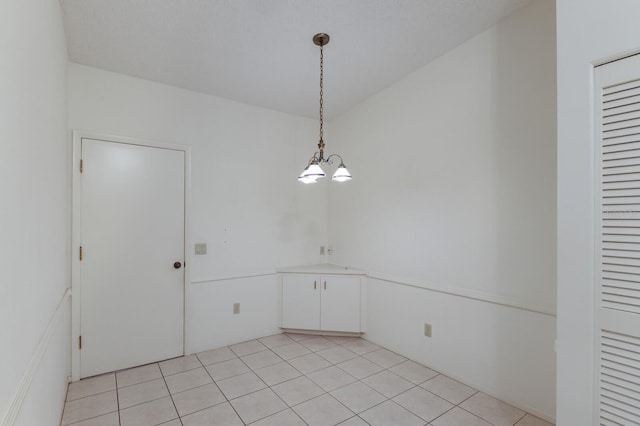 5712 Garden Lakes Dr, Bradenton, FL 34203 - empty room with a chandelier and light tile patterned floors