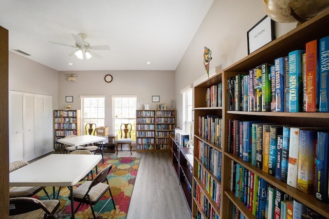5712 Garden Lakes Dr, Bradenton, FL 34203 - office area featuring bookshelves, wood finished floors, and a ceiling fan