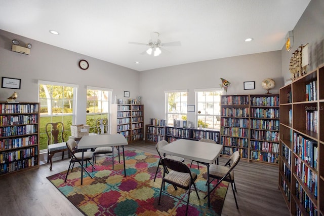 5712 Garden Lakes Dr, Bradenton, FL 34203 - office space with wall of books, wood finished floors, a ceiling fan, and recessed lighting