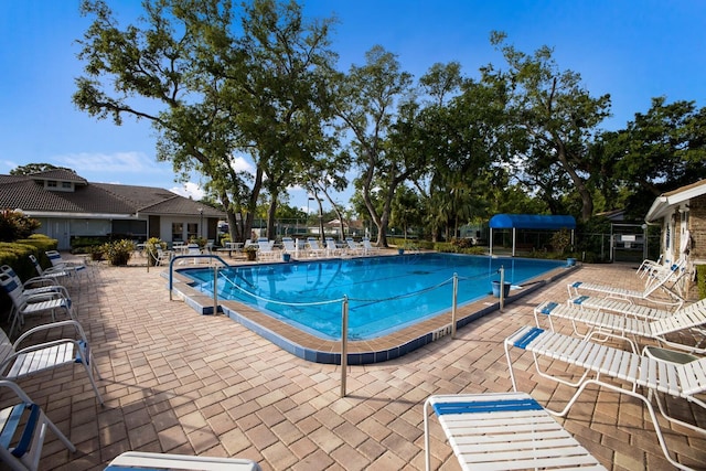 5712 Garden Lakes Dr, Bradenton, FL 34203 - community pool featuring a patio and fence