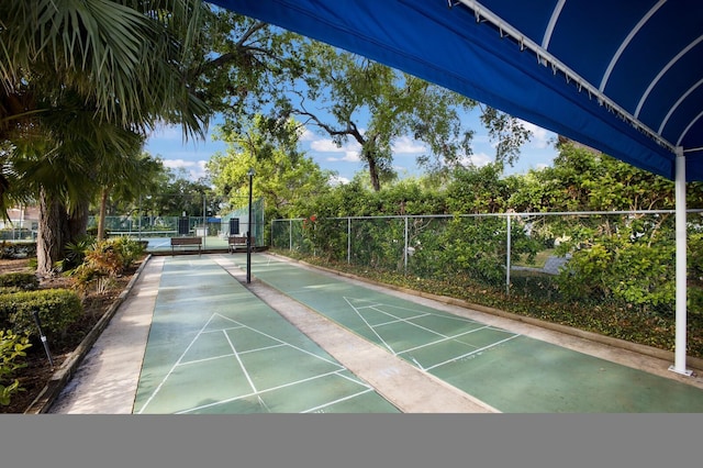 5712 Garden Lakes Dr, Bradenton, FL 34203 - view of home's community featuring fence and shuffleboard