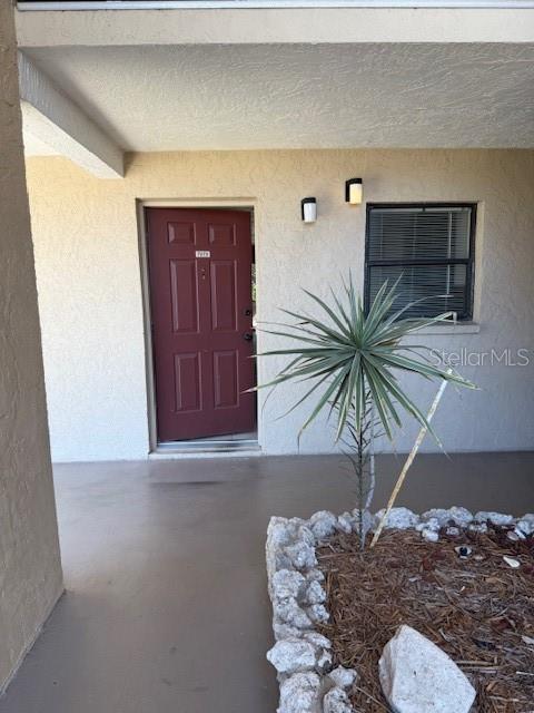 7273 Cloister Dr Unit 121, Sarasota, FL 34231 - entrance to property featuring stucco siding