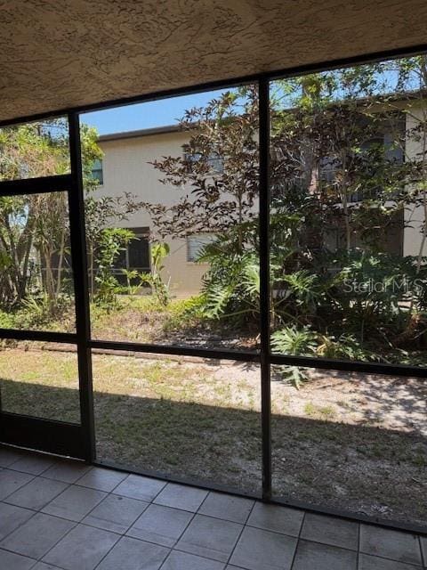 7273 Cloister Dr Unit 121, Sarasota, FL 34231 - entryway with tile patterned floors and plenty of natural light