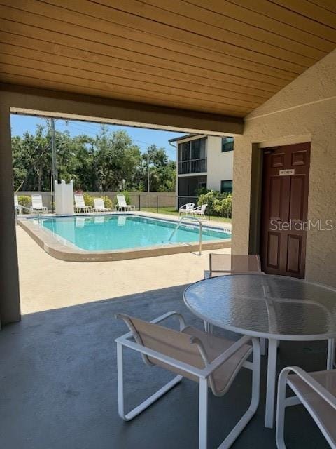 7273 Cloister Dr Unit 121, Sarasota, FL 34231 - community pool featuring a patio area