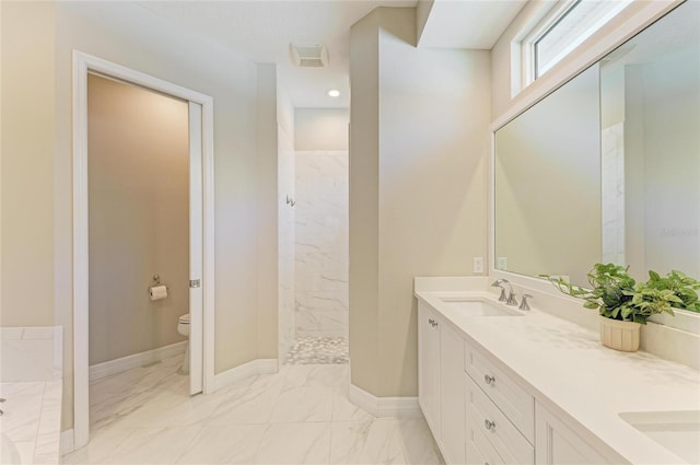 5035 Tobermory Way, Bradenton, FL 34211 - bathroom featuring marble finish floors, toilet, a marble finish shower, and baseboards