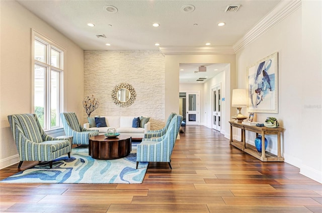 5035 Tobermory Way, Bradenton, FL 34211 - living room featuring wood finished floors, recessed lighting, baseboards, and crown molding