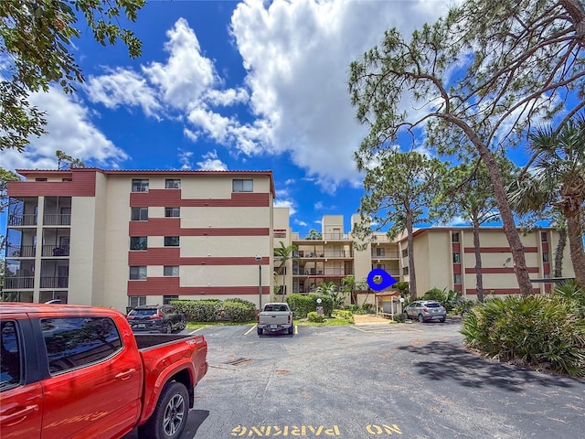 7500 40th Ave W Unit 108, Bradenton, FL 34209 - view of building exterior with uncovered parking