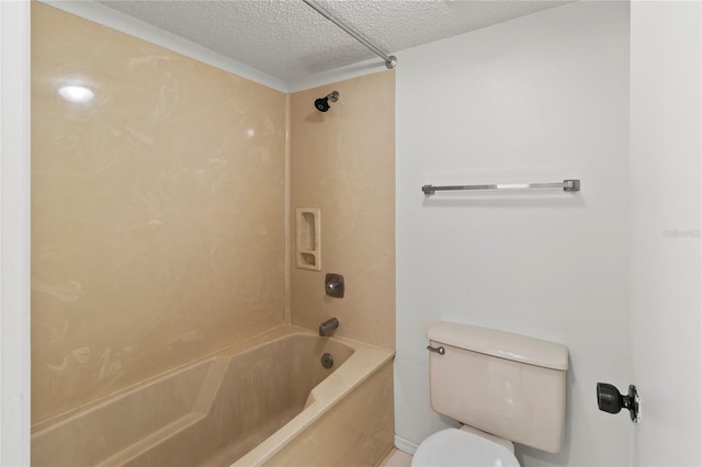 7500 40th Ave W Unit 108, Bradenton, FL 34209 - bathroom with a textured ceiling, toilet, and tub / shower combination