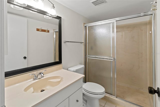 7500 40th Ave W Unit 108, Bradenton, FL 34209 - bathroom featuring toilet, a shower stall, vanity, and tile patterned flooring