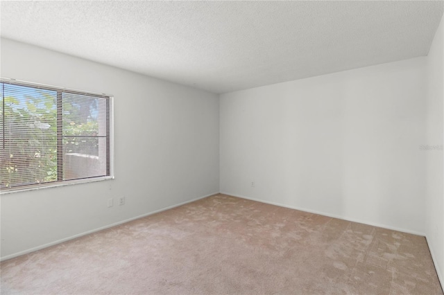 7500 40th Ave W Unit 108, Bradenton, FL 34209 - carpeted spare room with a textured ceiling