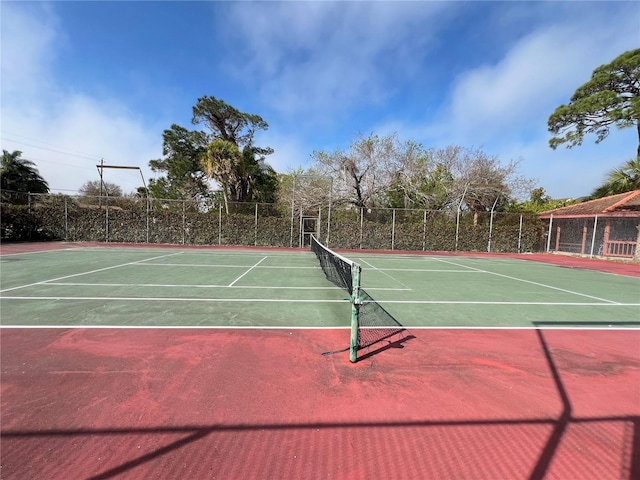 7500 40th Ave W Unit 108, Bradenton, FL 34209 - view of tennis court featuring community basketball court and fence