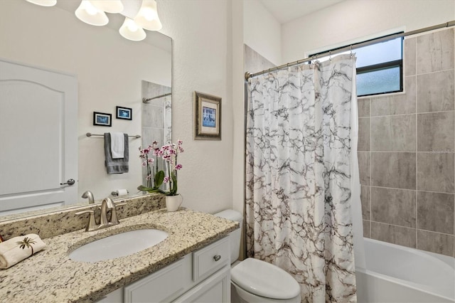 bathroom featuring toilet, shower / bathtub combination with curtain, vanity, and a chandelier