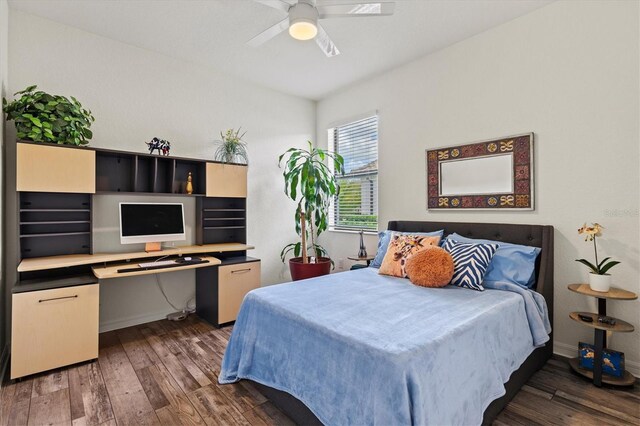 bedroom featuring hardwood / wood-style floors, baseboards, and ceiling fan