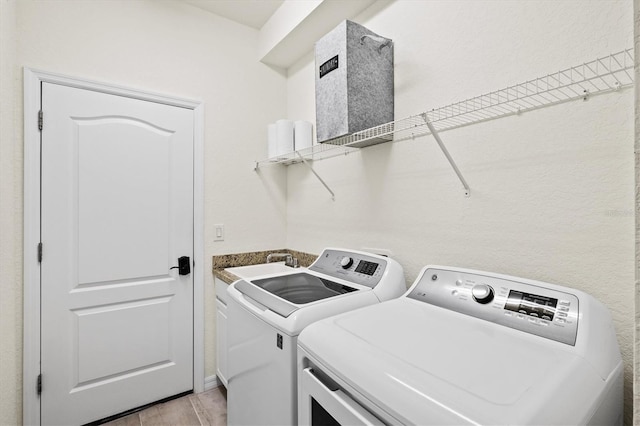 laundry room featuring washing machine and dryer