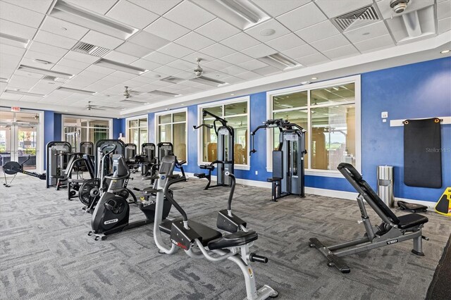 workout area with carpet floors, french doors, baseboards, and a paneled ceiling
