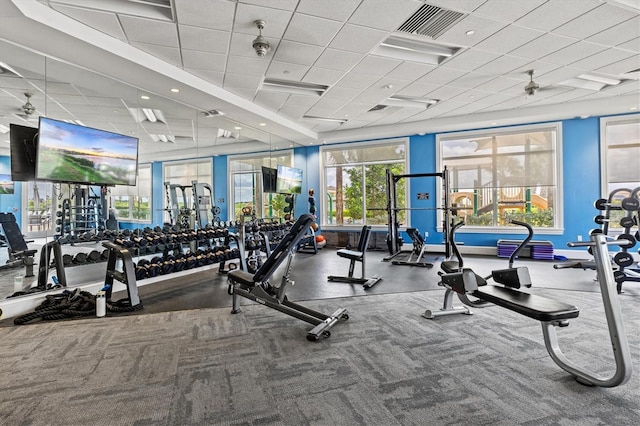 workout area featuring a paneled ceiling