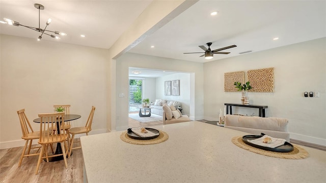 2825 Pinecrest St, Sarasota, FL 34239 - dining area with light wood-style floors, baseboards, recessed lighting, a chandelier, and a ceiling fan