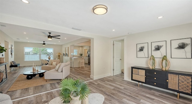 2825 Pinecrest St, Sarasota, FL 34239 - living room with ceiling fan, wood finished floors, baseboards, and recessed lighting