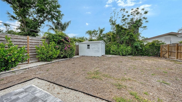 2825 Pinecrest St, Sarasota, FL 34239 - fenced backyard with a shed and an outbuilding