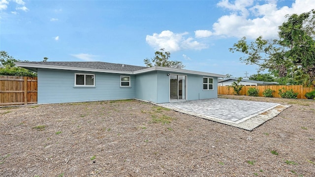 2825 Pinecrest St, Sarasota, FL 34239 - rear view of house featuring a patio area and a fenced backyard