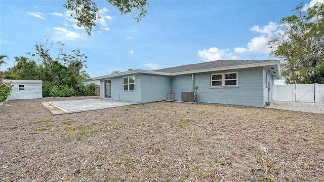 2825 Pinecrest St, Sarasota, FL 34239 - rear view of property featuring a patio area, fence, an outbuilding, a gate, and cooling unit