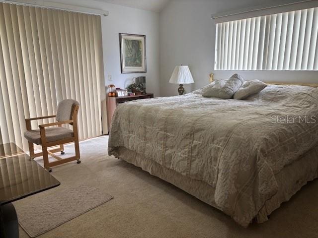 1212 Candlewood Dr, Lakeland, FL 33813 - bedroom featuring carpet floors and vaulted ceiling