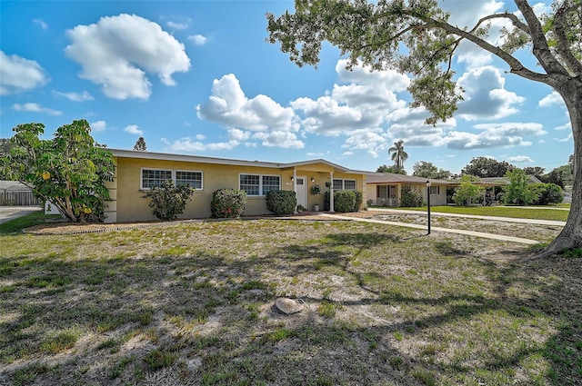 2708 27th Avenue Dr W, Bradenton, FL 34205 - ranch-style home with stucco siding and a front yard