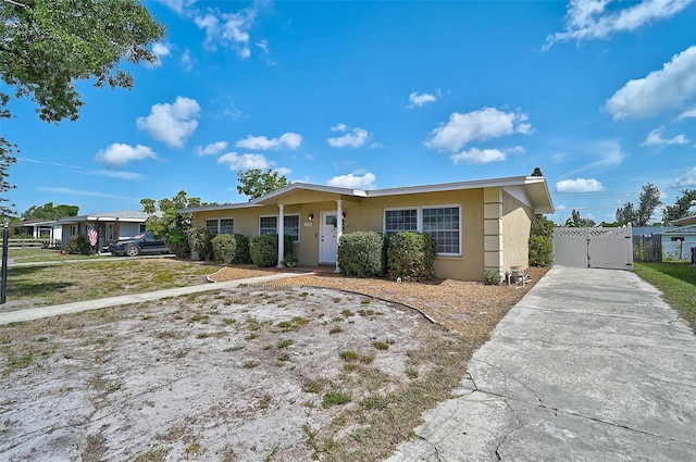 2708 27th Avenue Dr W, Bradenton, FL 34205 - single story home featuring a gate, stucco siding, and concrete driveway