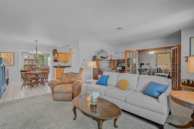 2708 27th Avenue Dr W, Bradenton, FL 34205 - living room featuring a chandelier, ceiling fan, and light tile patterned floors