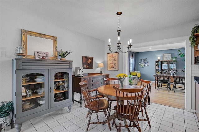 2708 27th Avenue Dr W, Bradenton, FL 34205 - dining room with light tile patterned floors and a chandelier